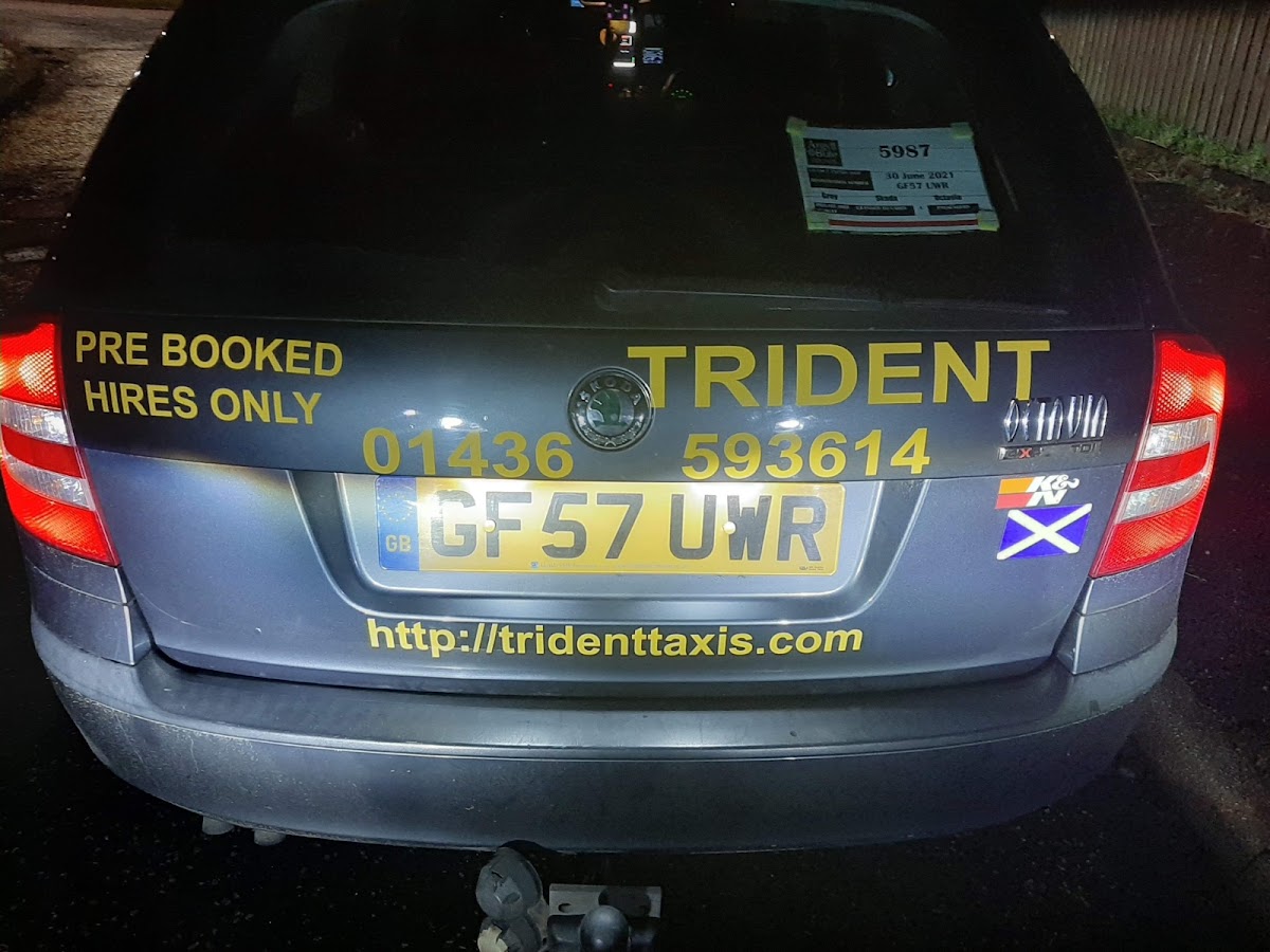 Trident Taxis branded Skoda estate, rear view